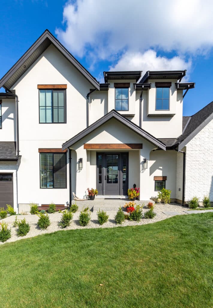 Close up shot of a Big white beautiful house in the suburbs.